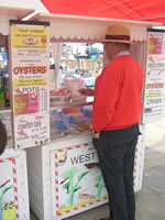 Whitstable  June 23rd 2012 - Bernard buying his supper (Photo by: Geoff)